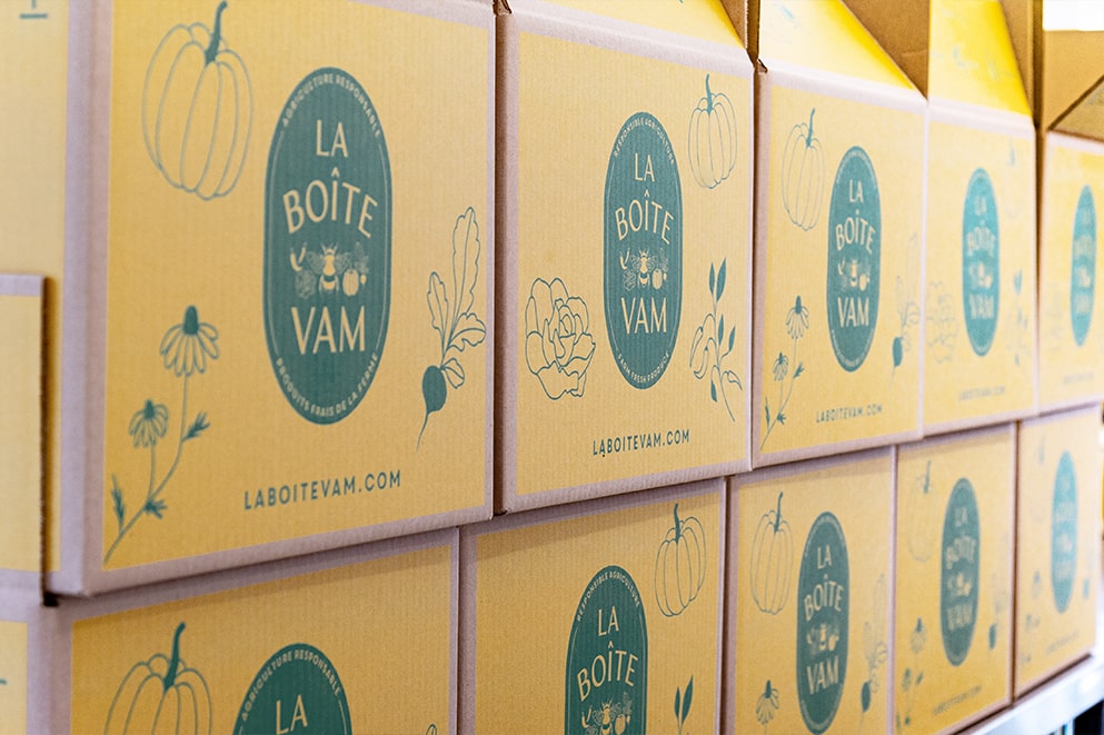 Photograph of branded shipping boxes for the food company La Boîte VAM